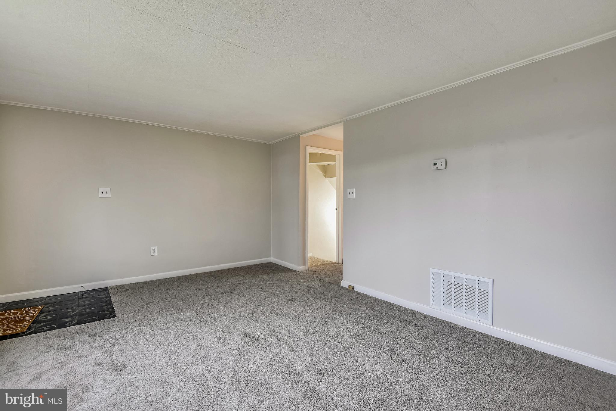 8025 Lansdale Road Baltimore, MD 21224 - Photo 11 of 36 Living Room with new carpet and paint