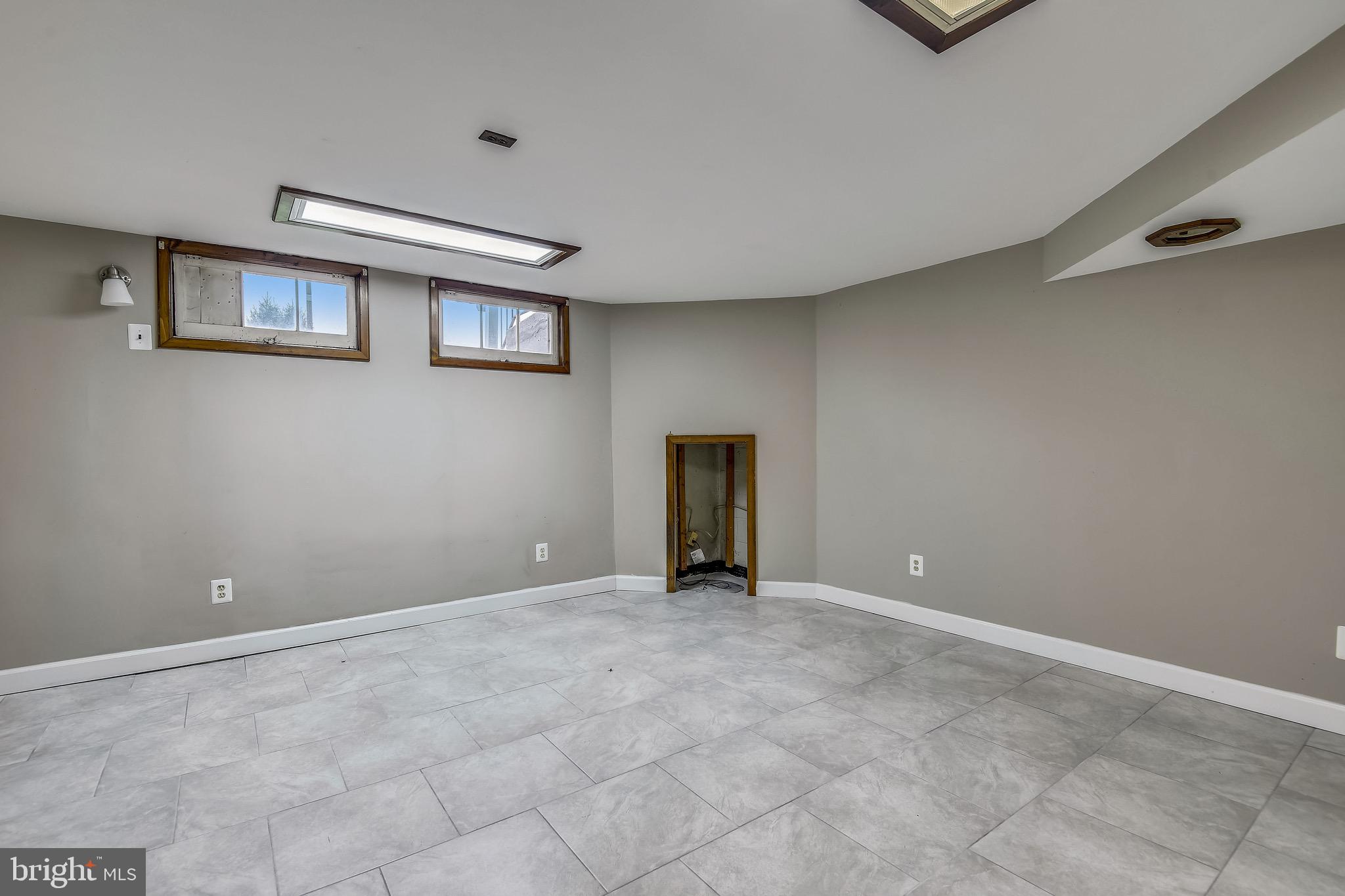 8025 Lansdale Road Baltimore, MD 21224 - Photo 3 of 36 Lower Level Rec room