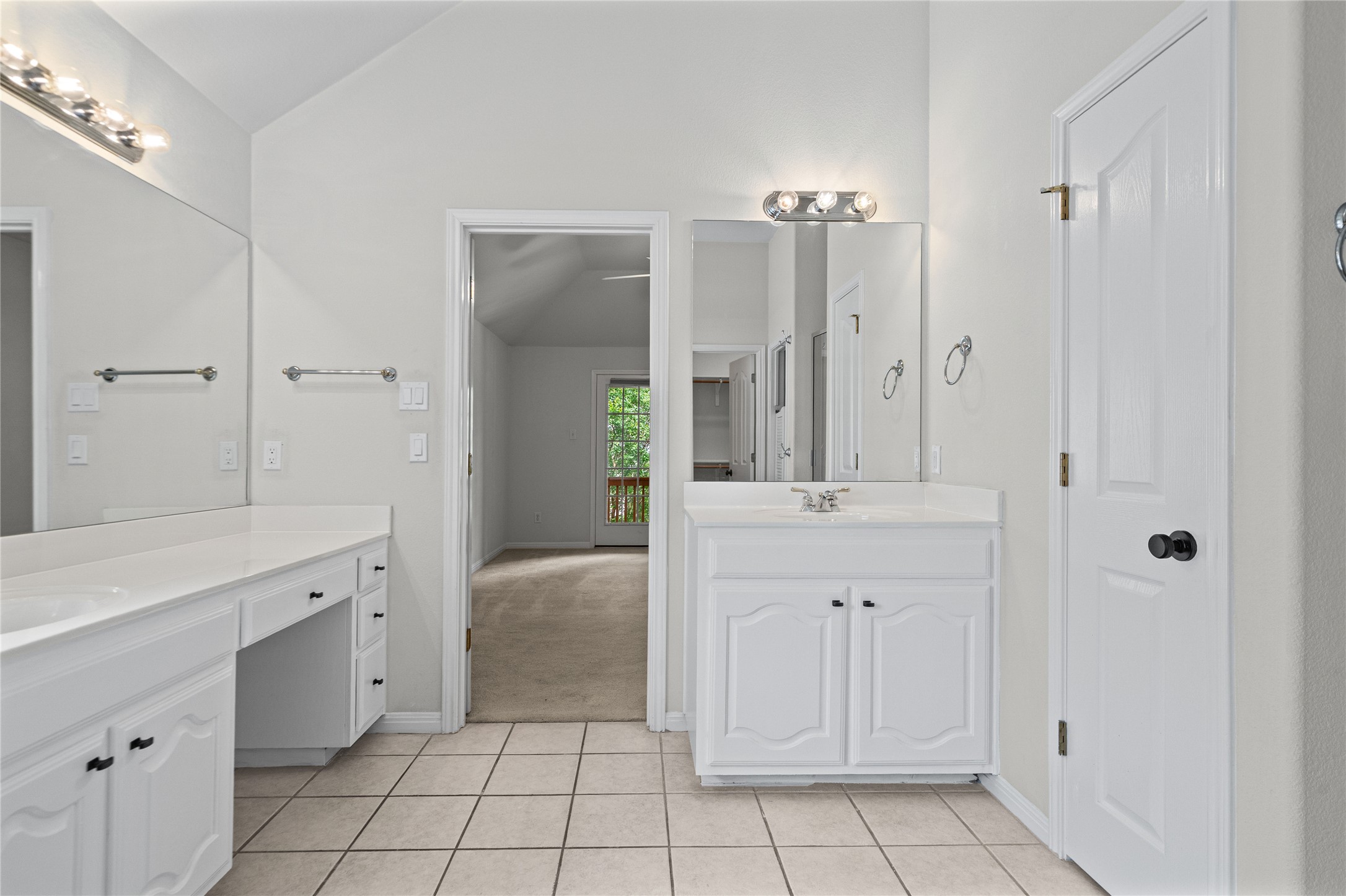 10700 Pointe View Drive Austin, TX 78738 - Photo 23 of 35 Double vanities with ample counter space offer practical elegance in this well-appointed bathroom.