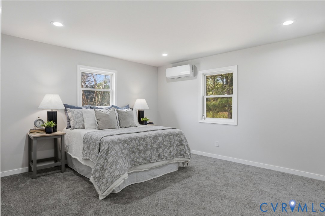 3490 Willow Brook Road Bumpass, VA 23024 - Photo 12 of 29 a spacious bedroom with a bed and a window