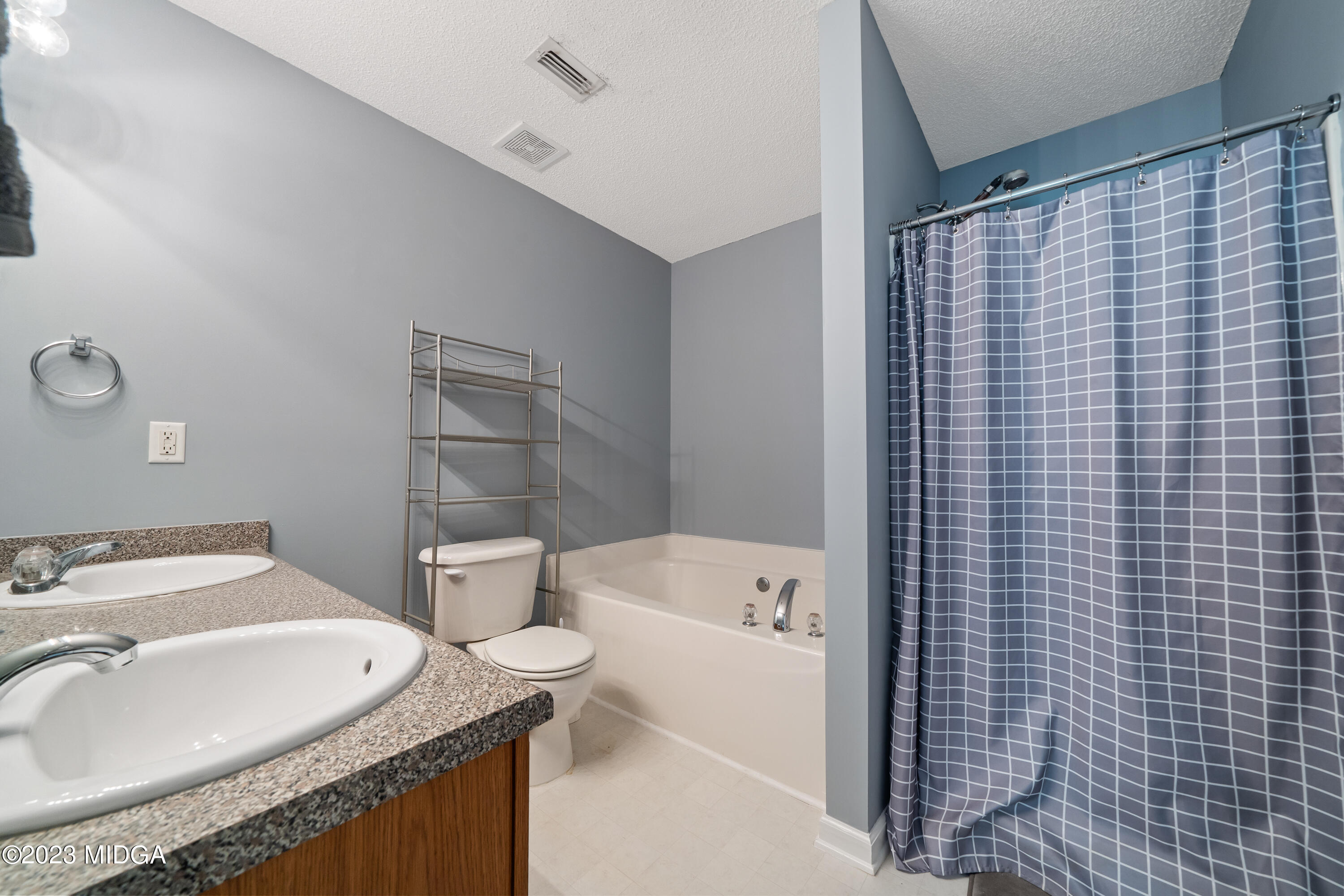 259 Autumn Ridge Court Gray, GA 31032 - Photo 13 of 18 a bathroom with a granite countertop sink toilet and shower