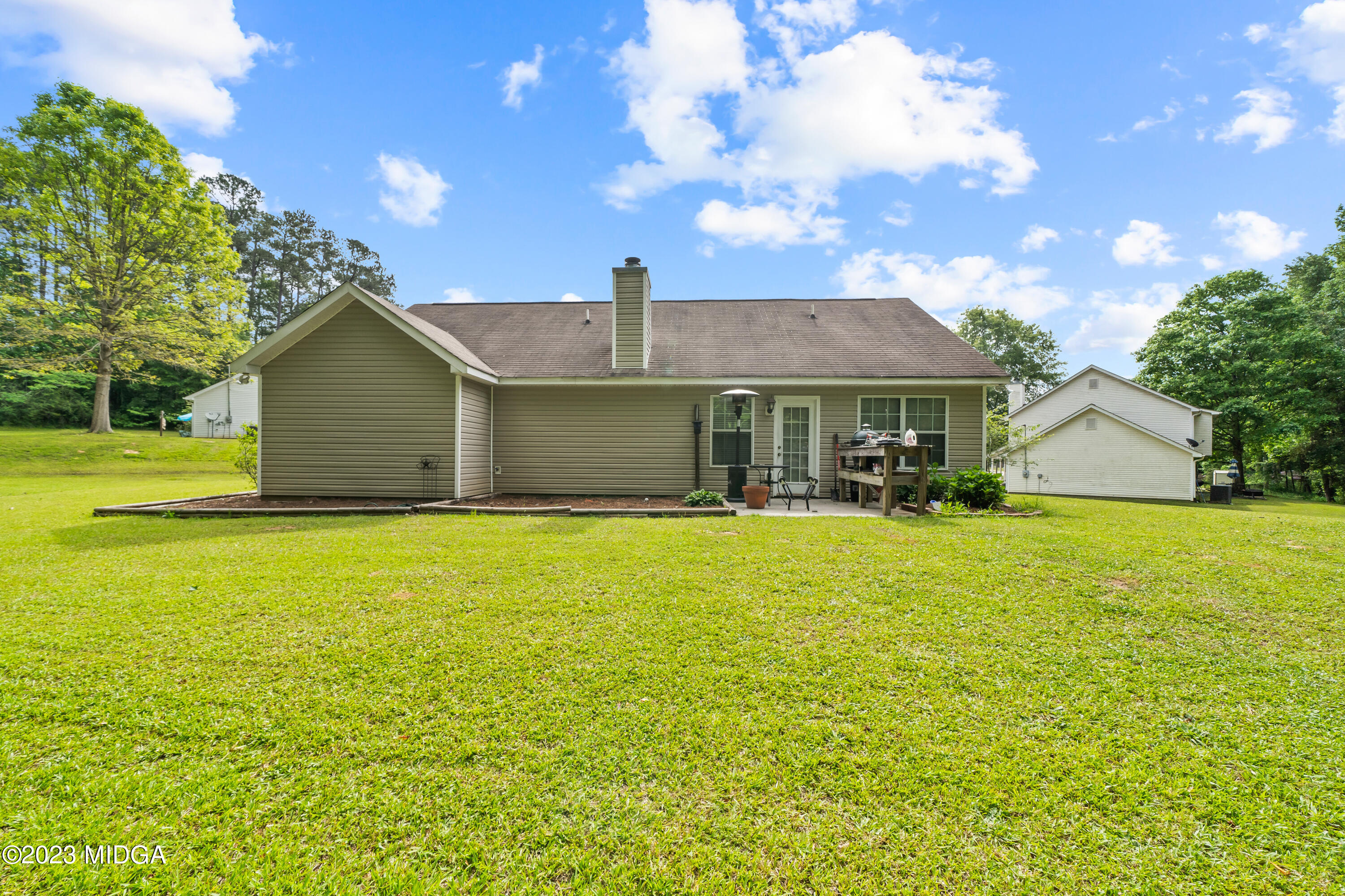 259 Autumn Ridge Court Gray, GA 31032 - Photo 17 of 18 a front view of a house with a garden