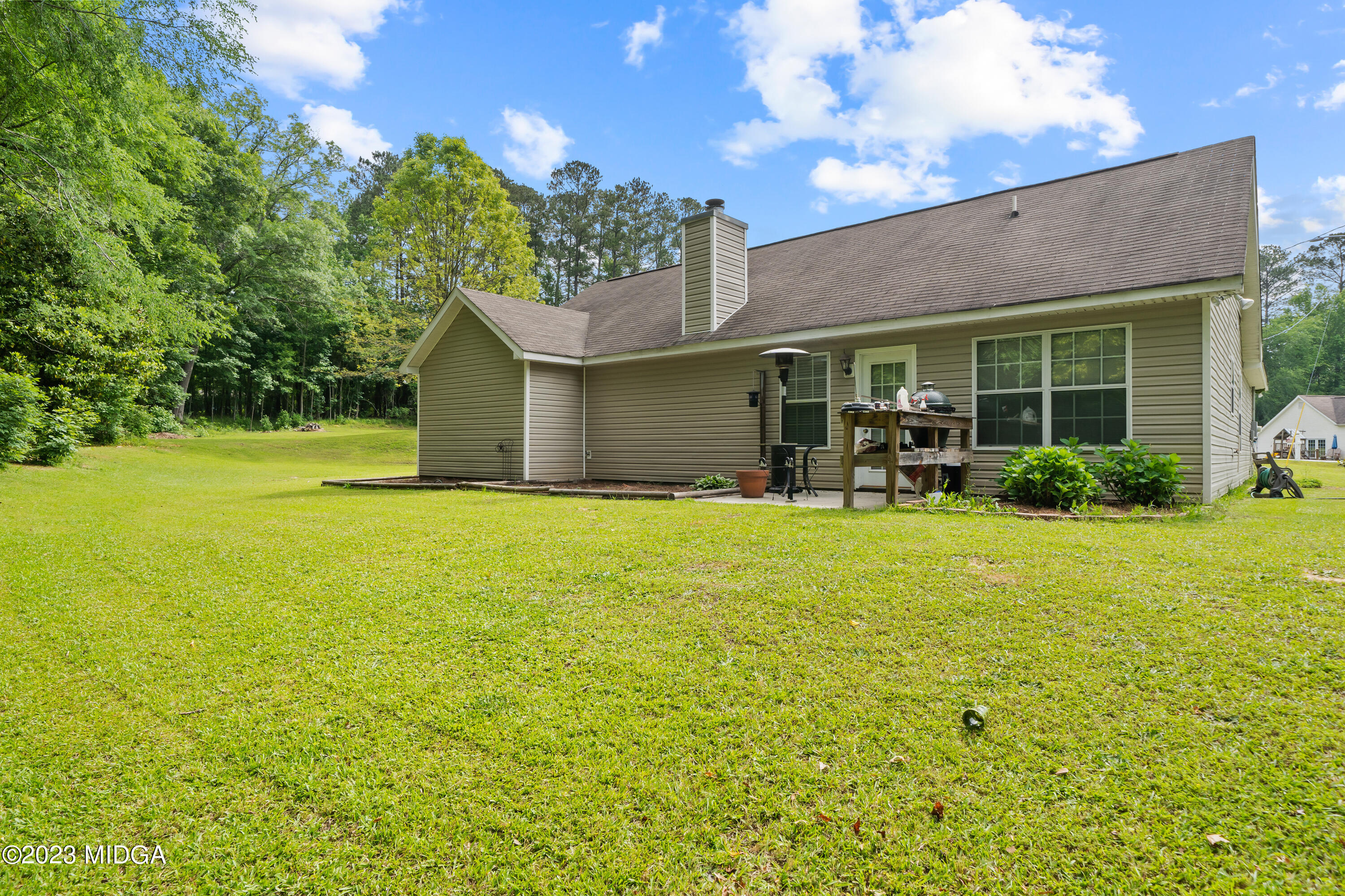 259 Autumn Ridge Court Gray, GA 31032 - Photo 18 of 18 a front view of house with yard and outdoor seating