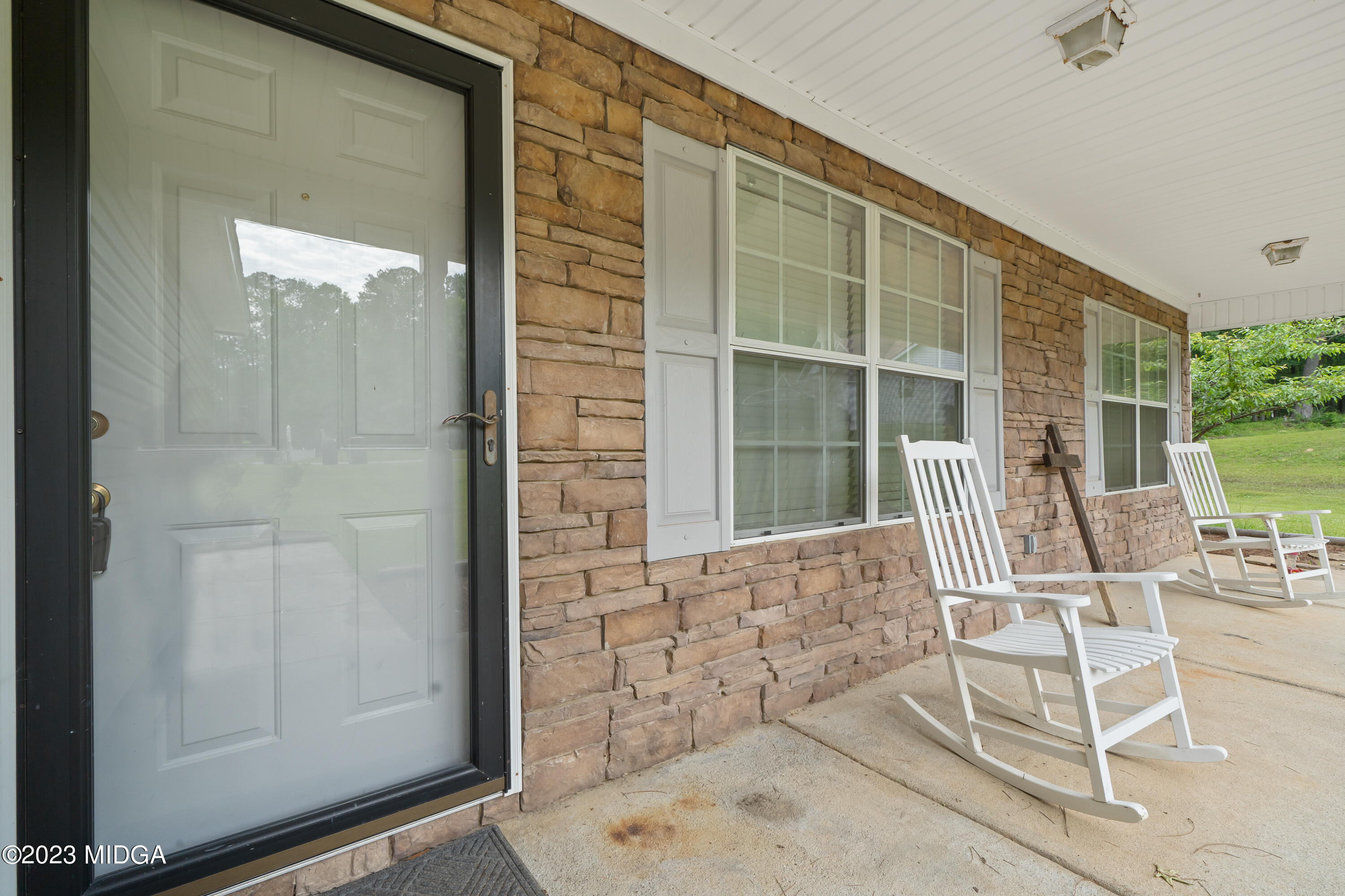 259 Autumn Ridge Court Gray, GA 31032 - Photo 4 of 18 wooden bench in front of house