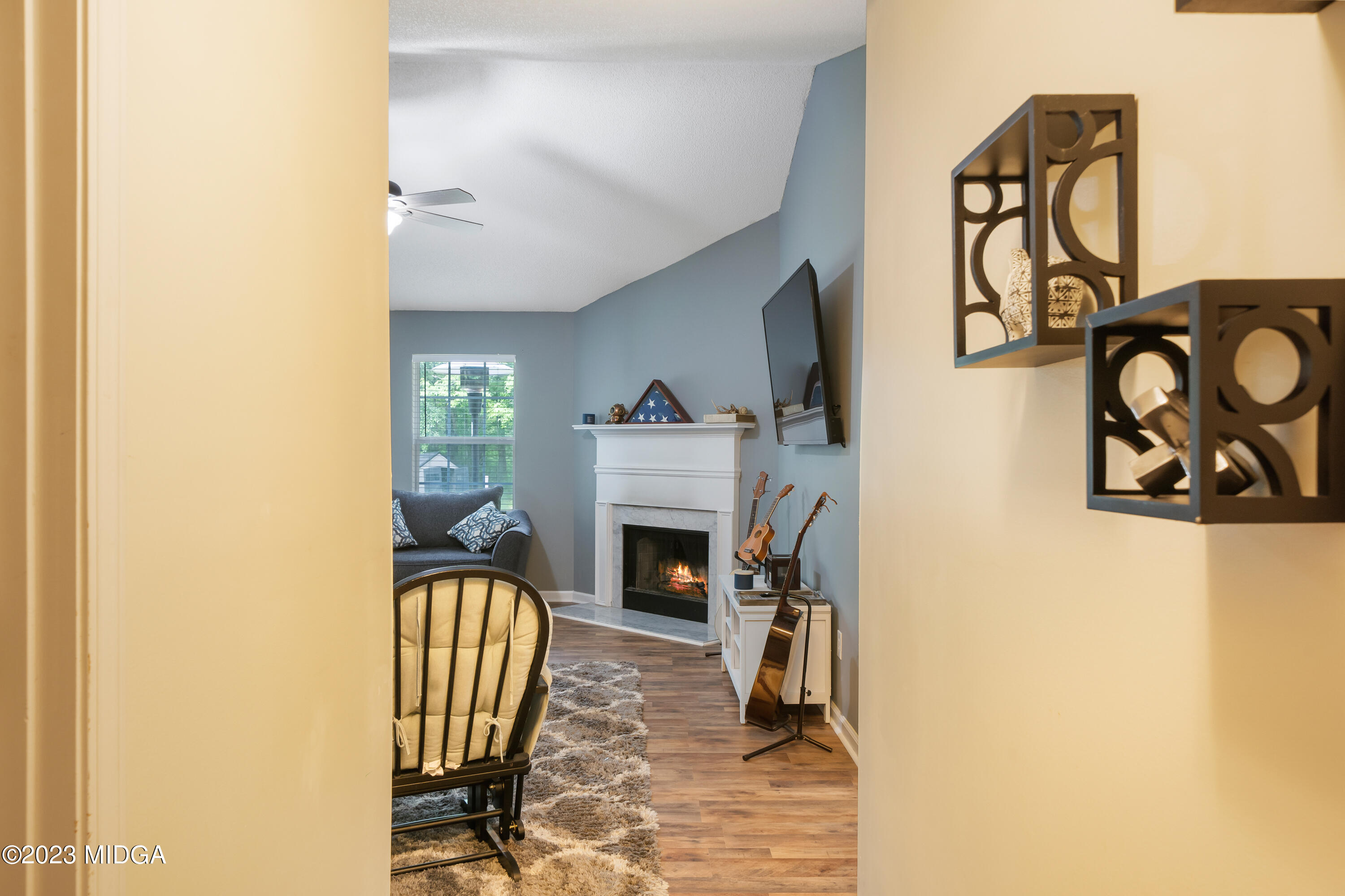 259 Autumn Ridge Court Gray, GA 31032 - Photo 5 of 18 a view of a livingroom with furniture and a fireplace