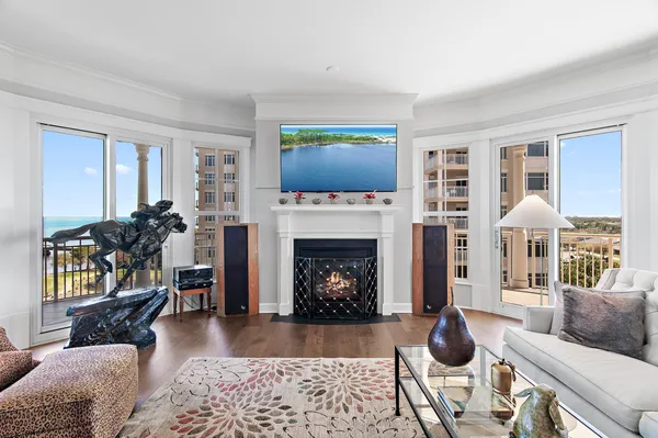 a view of a balcony with furniture and floor to ceiling window