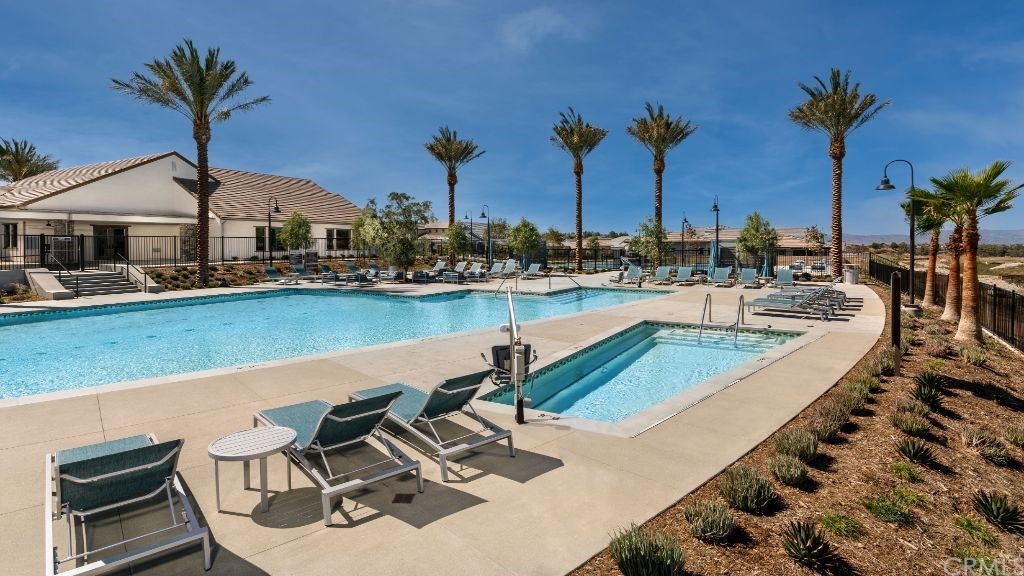 32081 Hyacinth Way Temecula, CA 92591 - Photo 13 of 16 a view of a swimming pool with chairs