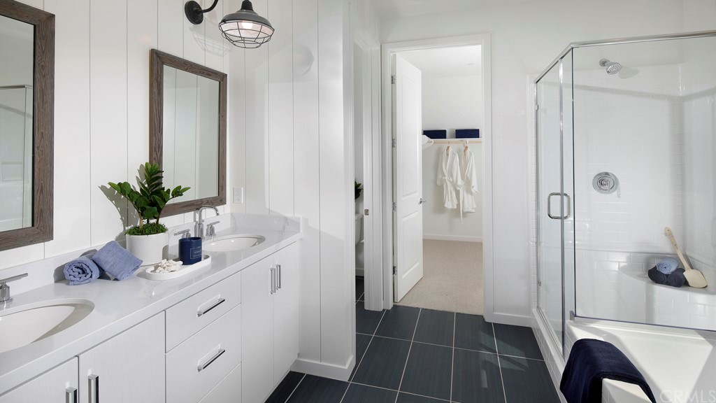 32081 Hyacinth Way Temecula, CA 92591 - Photo 9 of 16 a bathroom with a shower sink and mirror