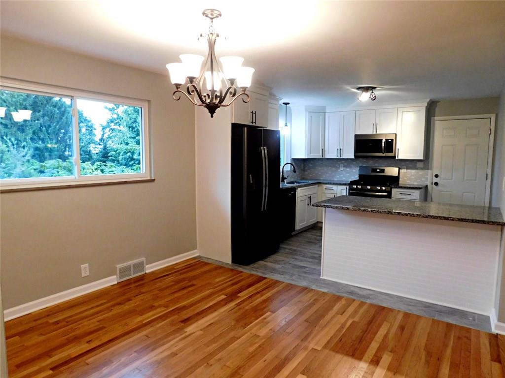 26 Porters Hollow Road Coraopolis, PA 15108 - Photo 11 of 25 Dining area opens to the kitchen on one side and living room on the other