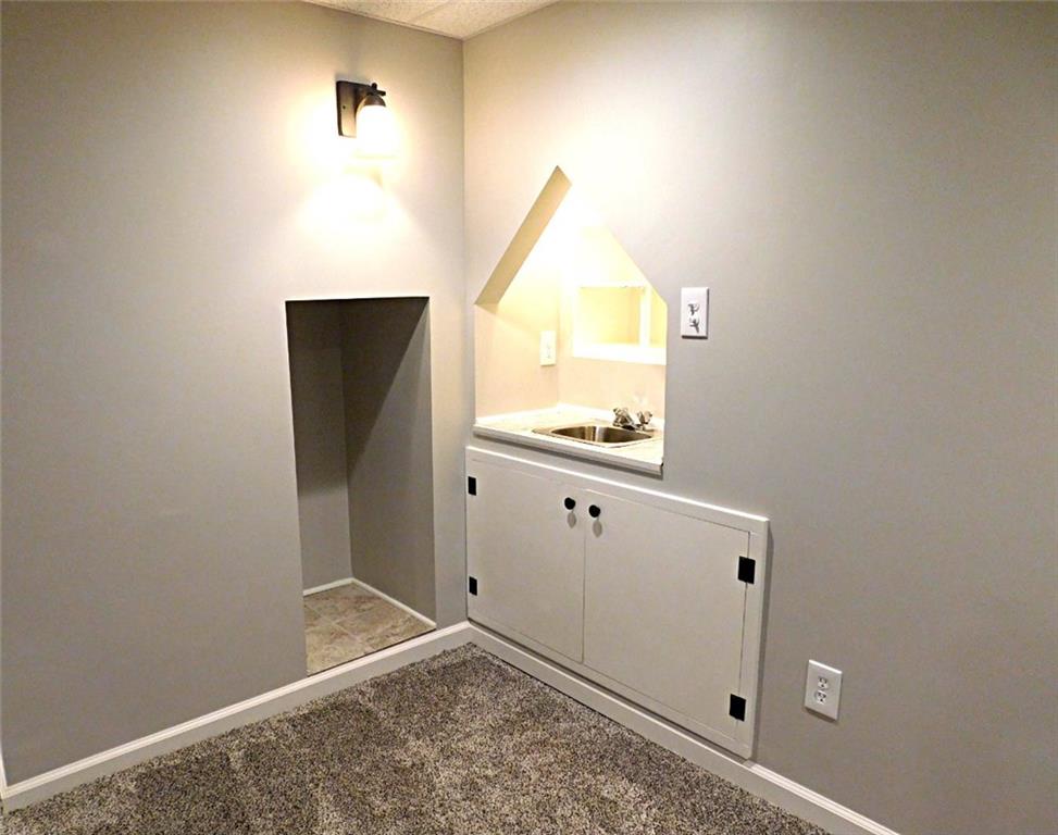 26 Porters Hollow Road Coraopolis, PA 15108 - Photo 22 of 25 bar area with sink and storage cabinets and cubby for mini fridge or wine cooler
