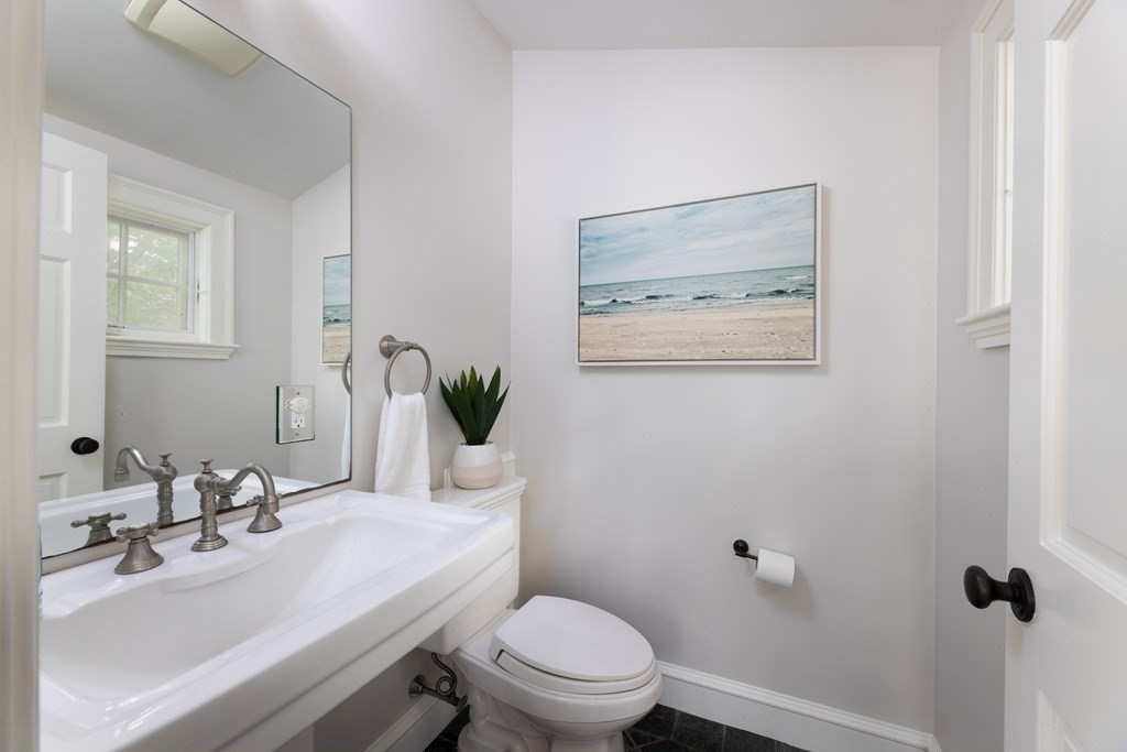 43 Somerset Road Brookline, MA 02445 - Photo 10 of 18 a bathroom with a toilet a sink and mirror