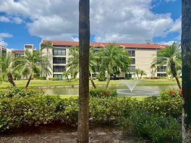 a view of a fountain in front of a house