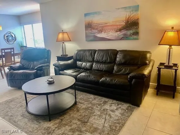 a utility room with a wooden floor washer and dryer