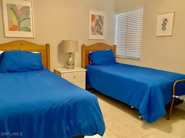 a kitchen with granite countertop a stove sink and cabinets