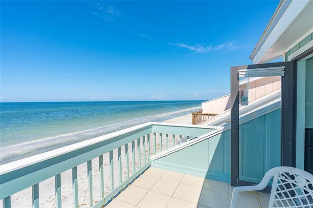 a view of balcony with furniture
