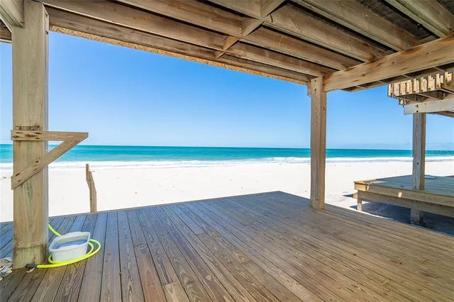 a view of outdoor space with wooden floor