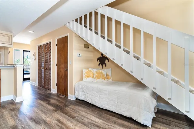 a bedroom with wooden floor