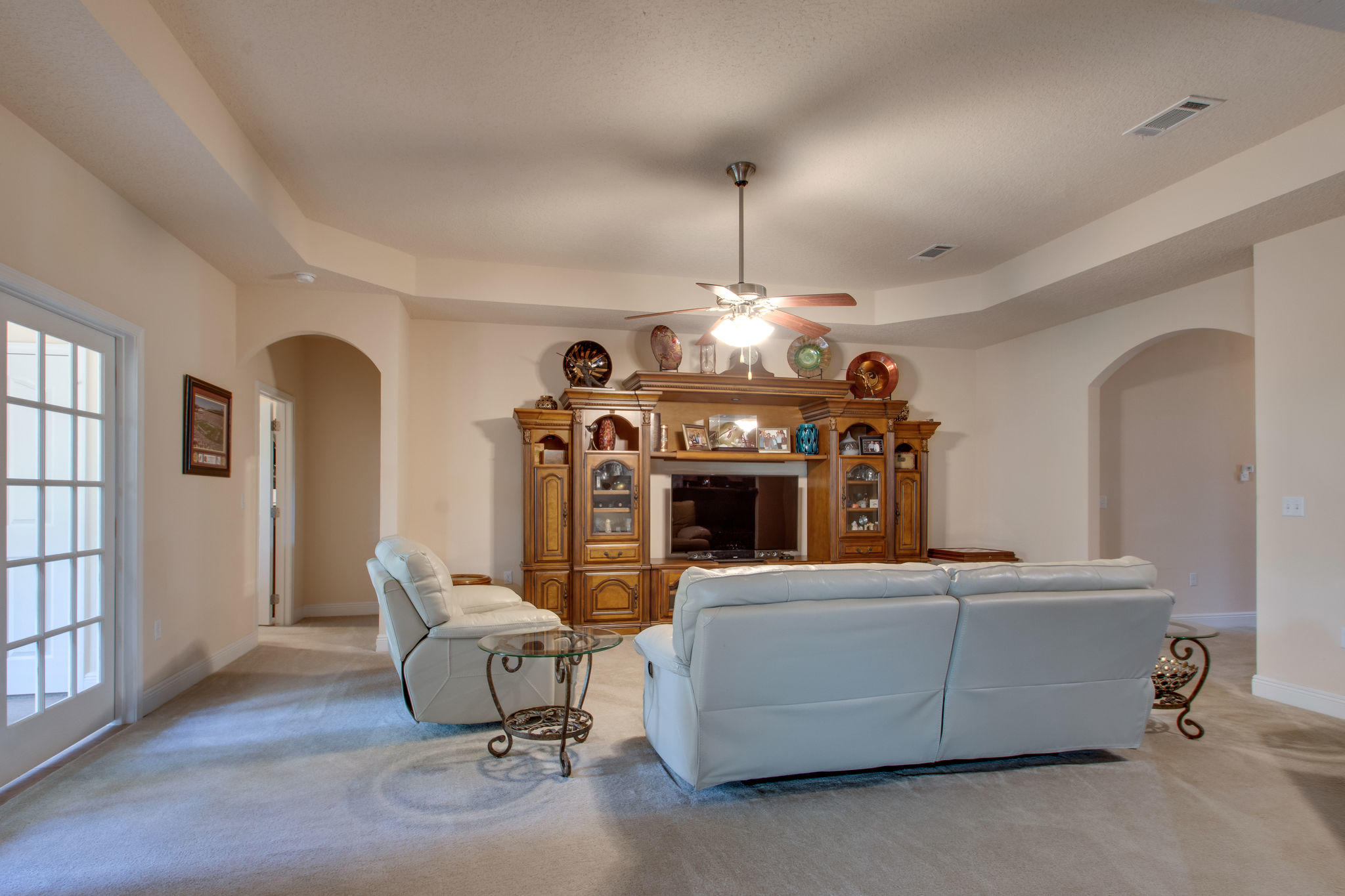 446 Mango Lane Freeport, FL 32439 - Photo 11 of 48 a living room with furniture a fireplace and a chandelier