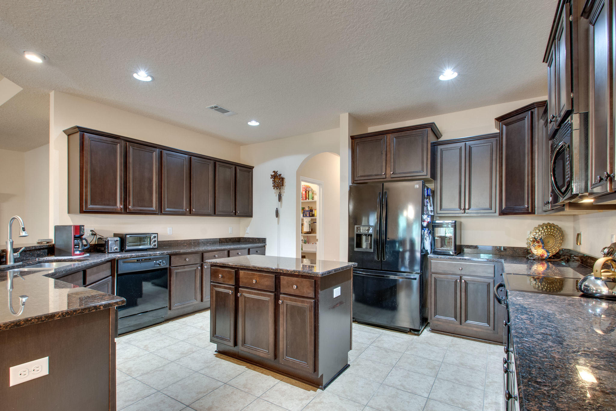 446 Mango Lane Freeport, FL 32439 - Photo 12 of 48 a kitchen with a sink and cabinets