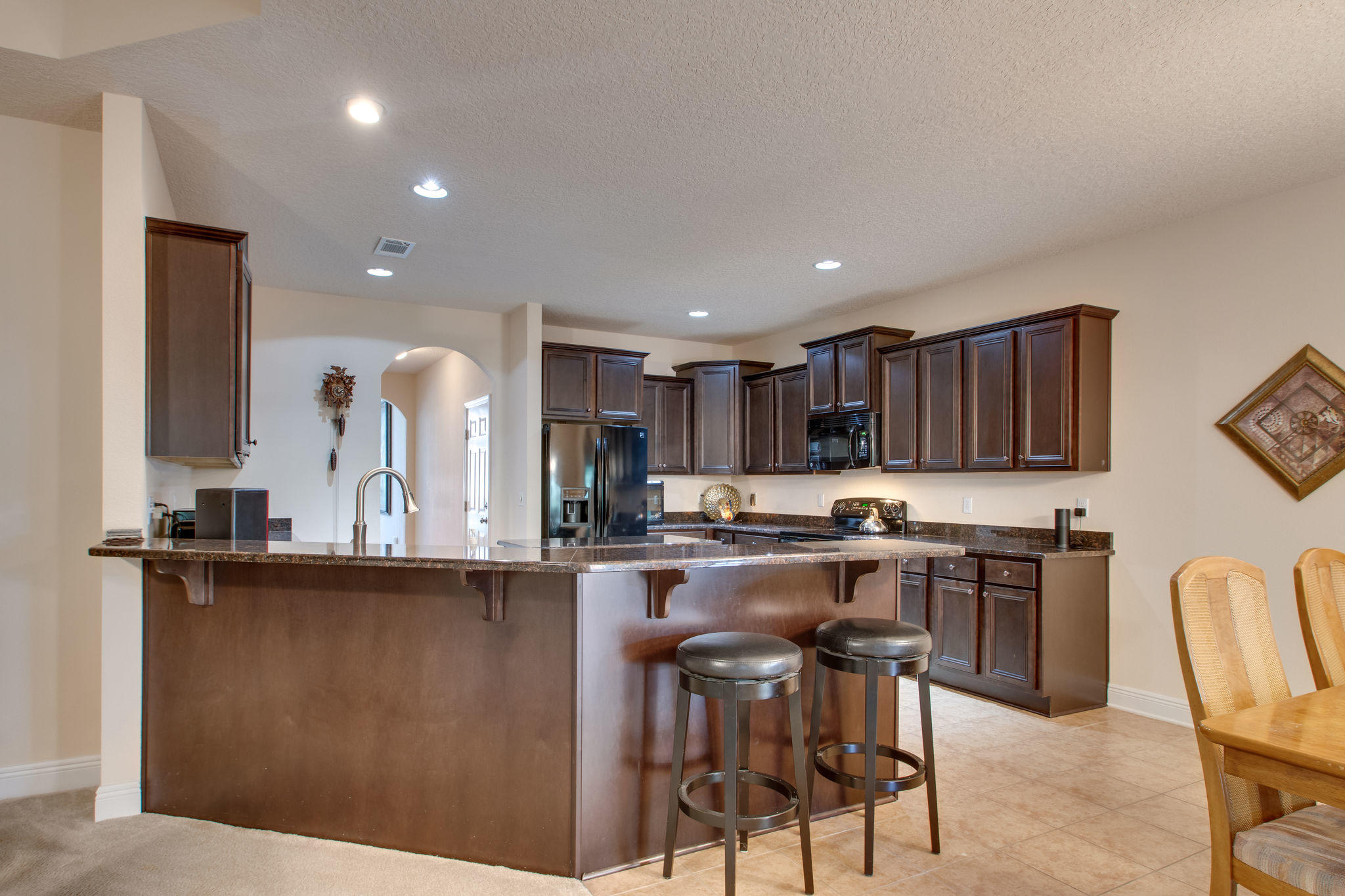 446 Mango Lane Freeport, FL 32439 - Photo 13 of 48 a kitchen with kitchen island granite countertop a sink and cabinets