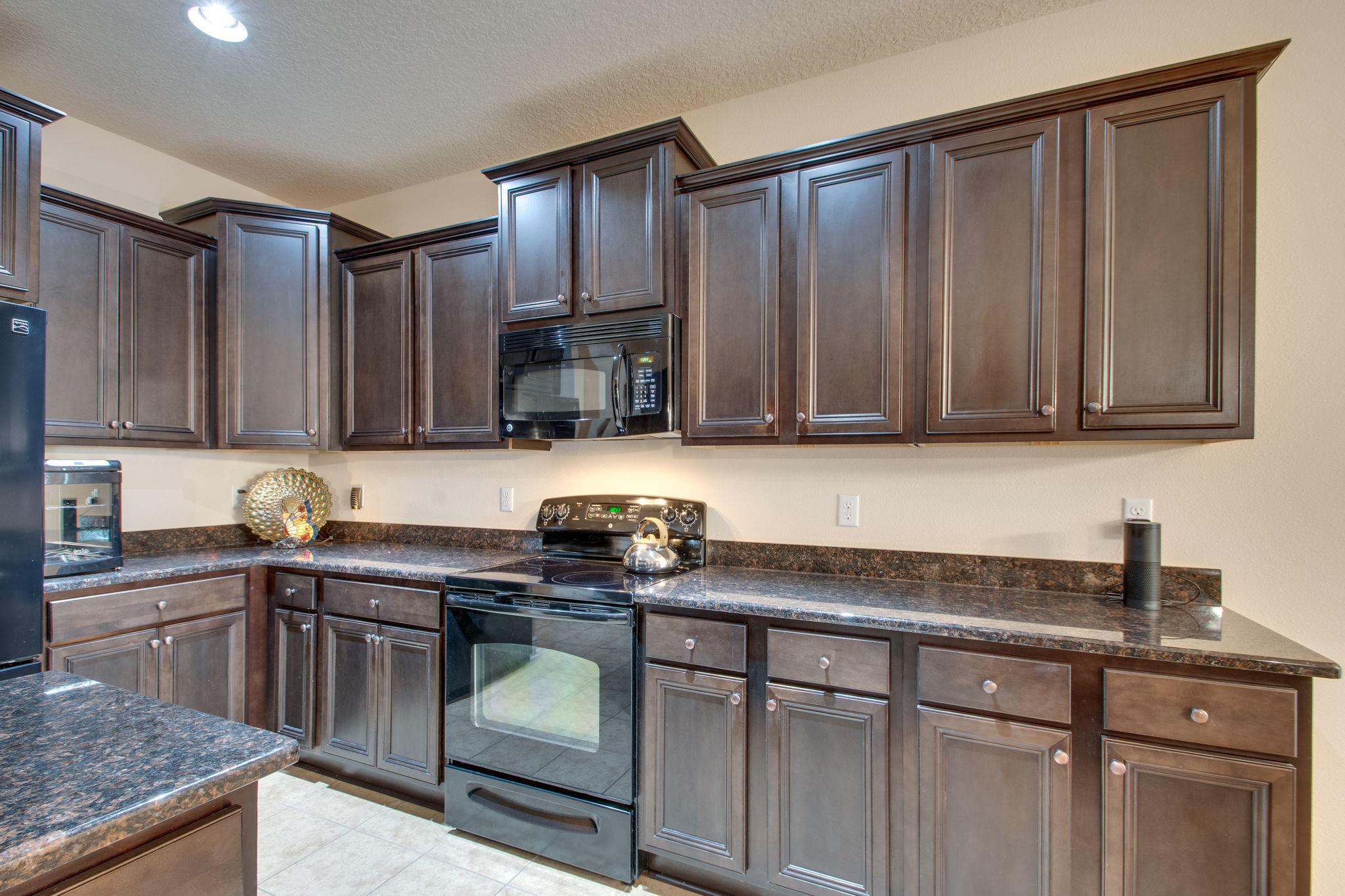 446 Mango Lane Freeport, FL 32439 - Photo 14 of 48 a kitchen with stainless steel appliances granite countertop a sink stove and cabinets