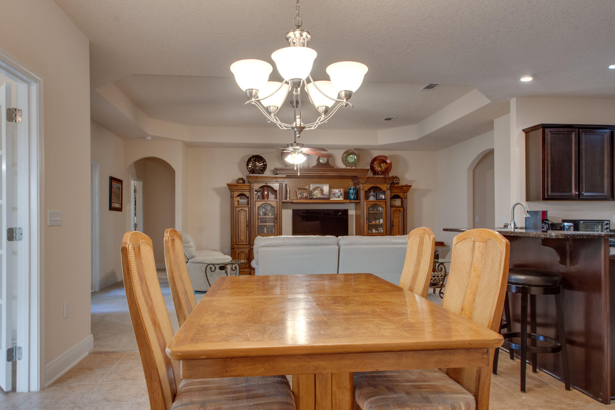 446 Mango Lane Freeport, FL 32439 - Photo 18 of 48 a view of a dining room with furniture and chandelier