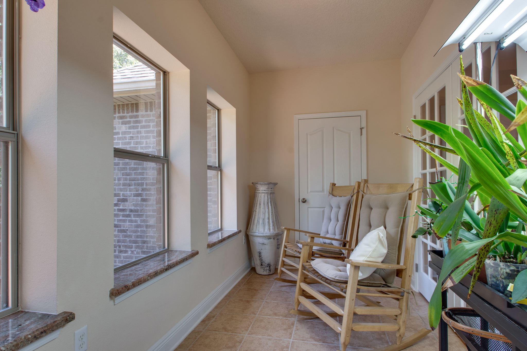 446 Mango Lane Freeport, FL 32439 - Photo 20 of 48 a view of a room with chairs and flower pot