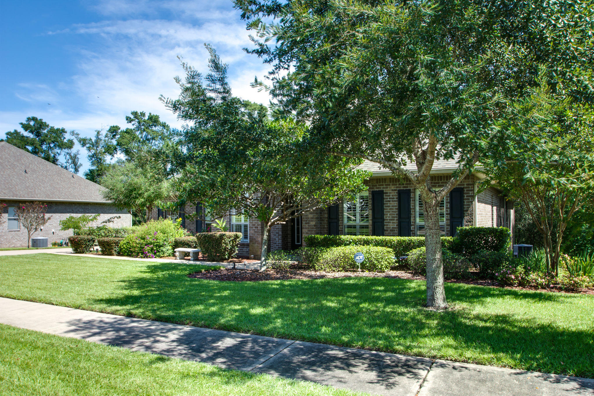 446 Mango Lane Freeport, FL 32439 - Photo 3 of 48 a front view of a house with garden
