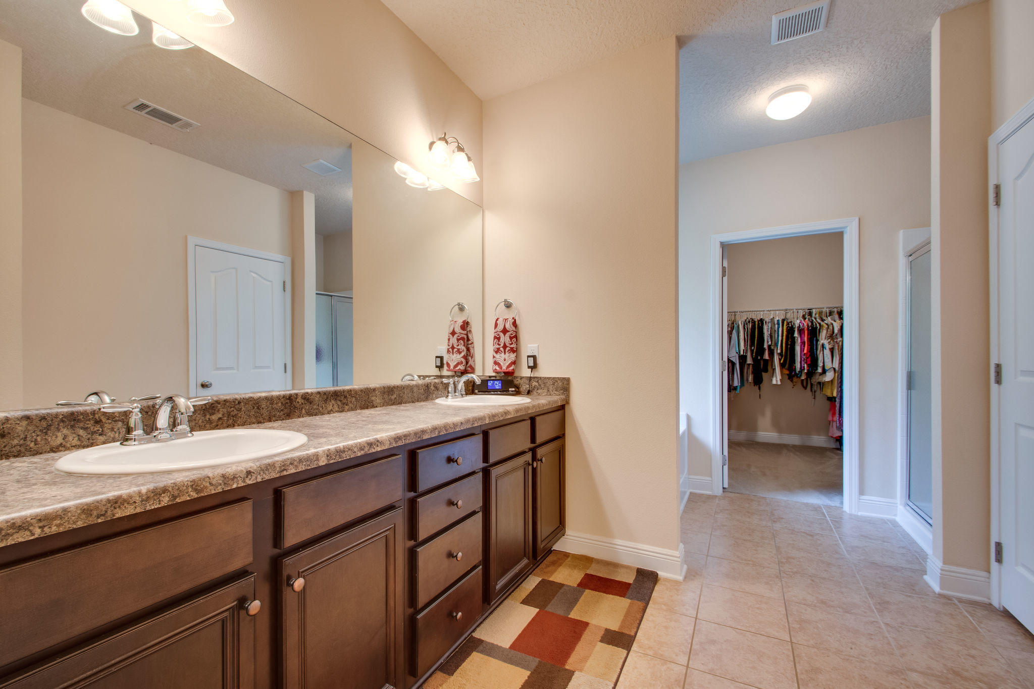 446 Mango Lane Freeport, FL 32439 - Photo 23 of 48 a spacious bathroom with a double vanity sink and a mirror