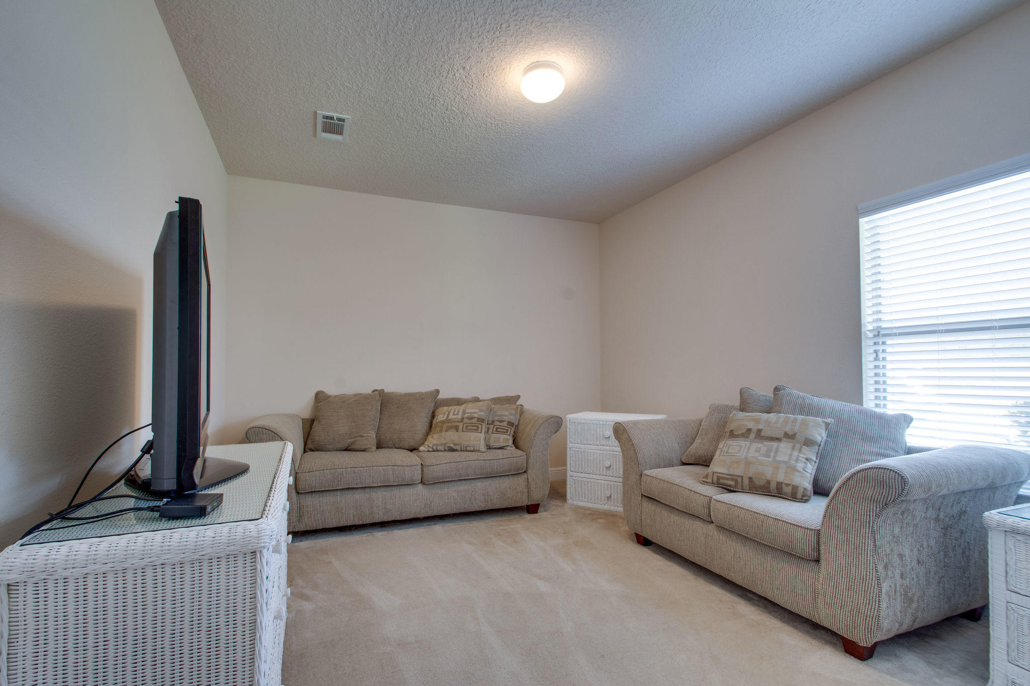 446 Mango Lane Freeport, FL 32439 - Photo 25 of 48 a living room with furniture and a flat screen tv