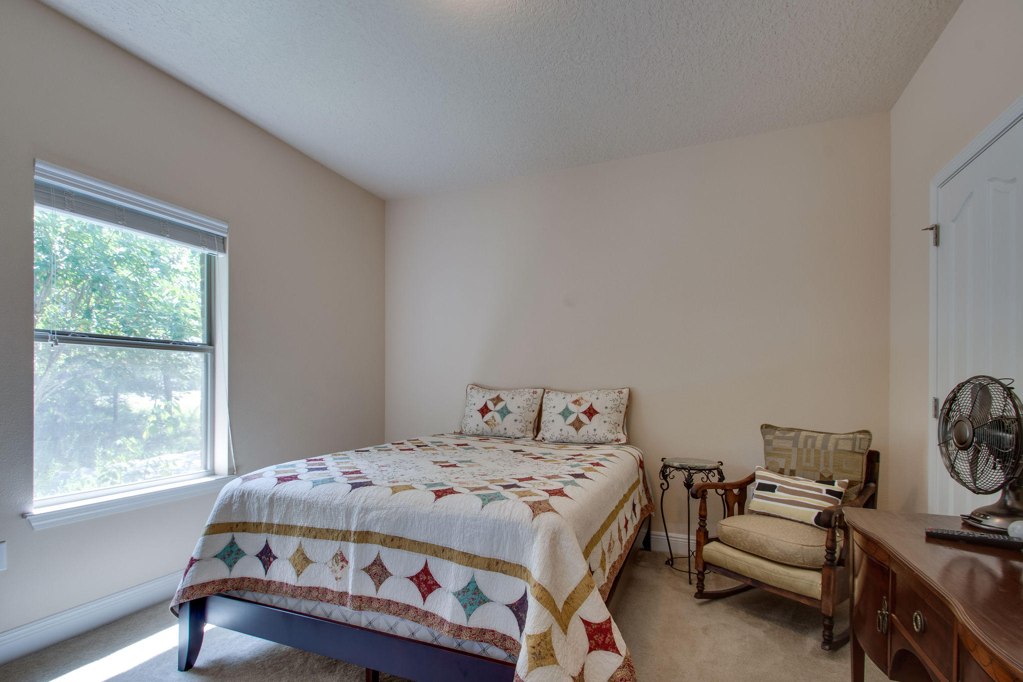 446 Mango Lane Freeport, FL 32439 - Photo 26 of 48 a bedroom with a bed and a window
