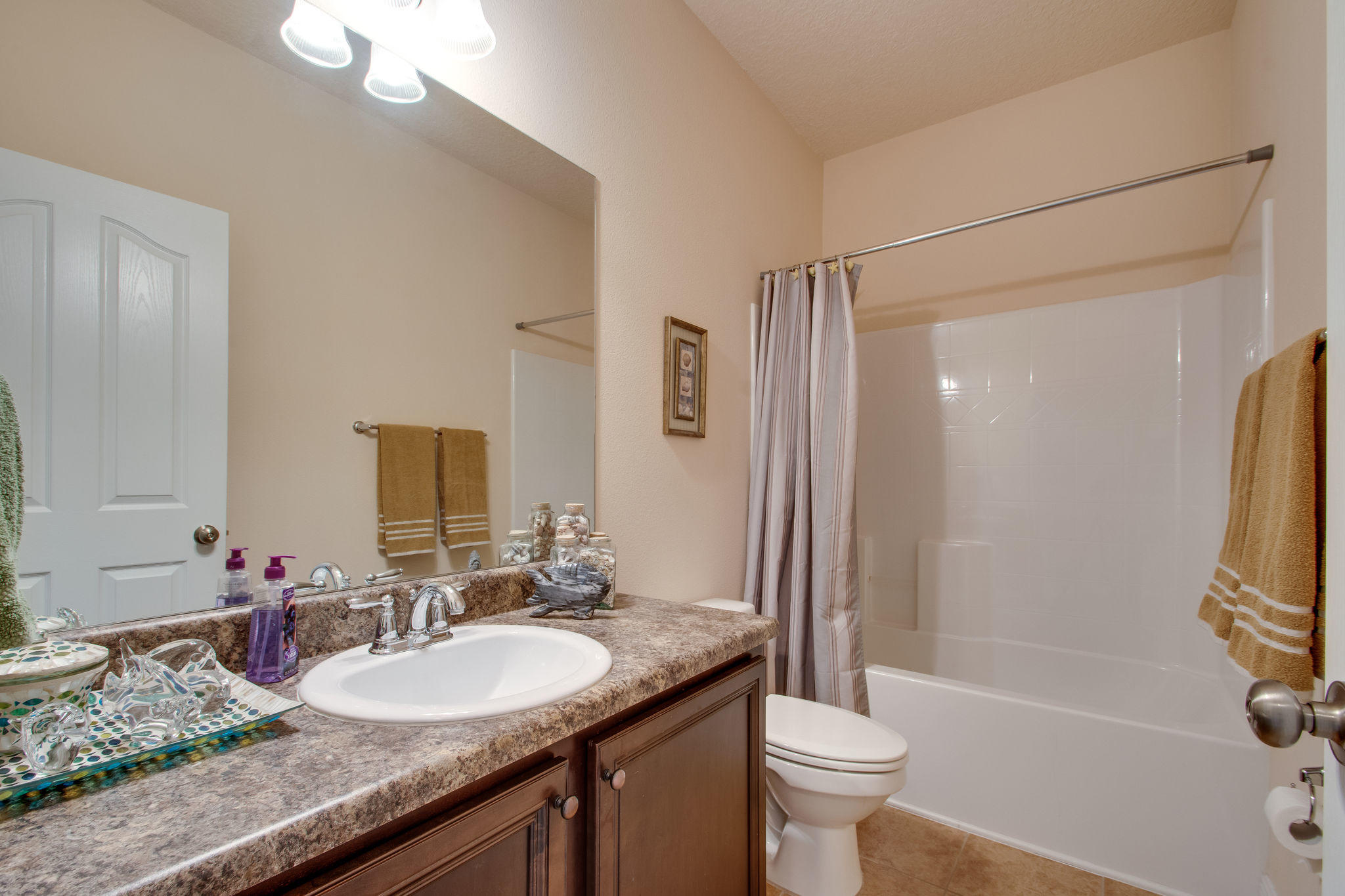 446 Mango Lane Freeport, FL 32439 - Photo 28 of 48 a bathroom with a granite countertop sink toilet and shower