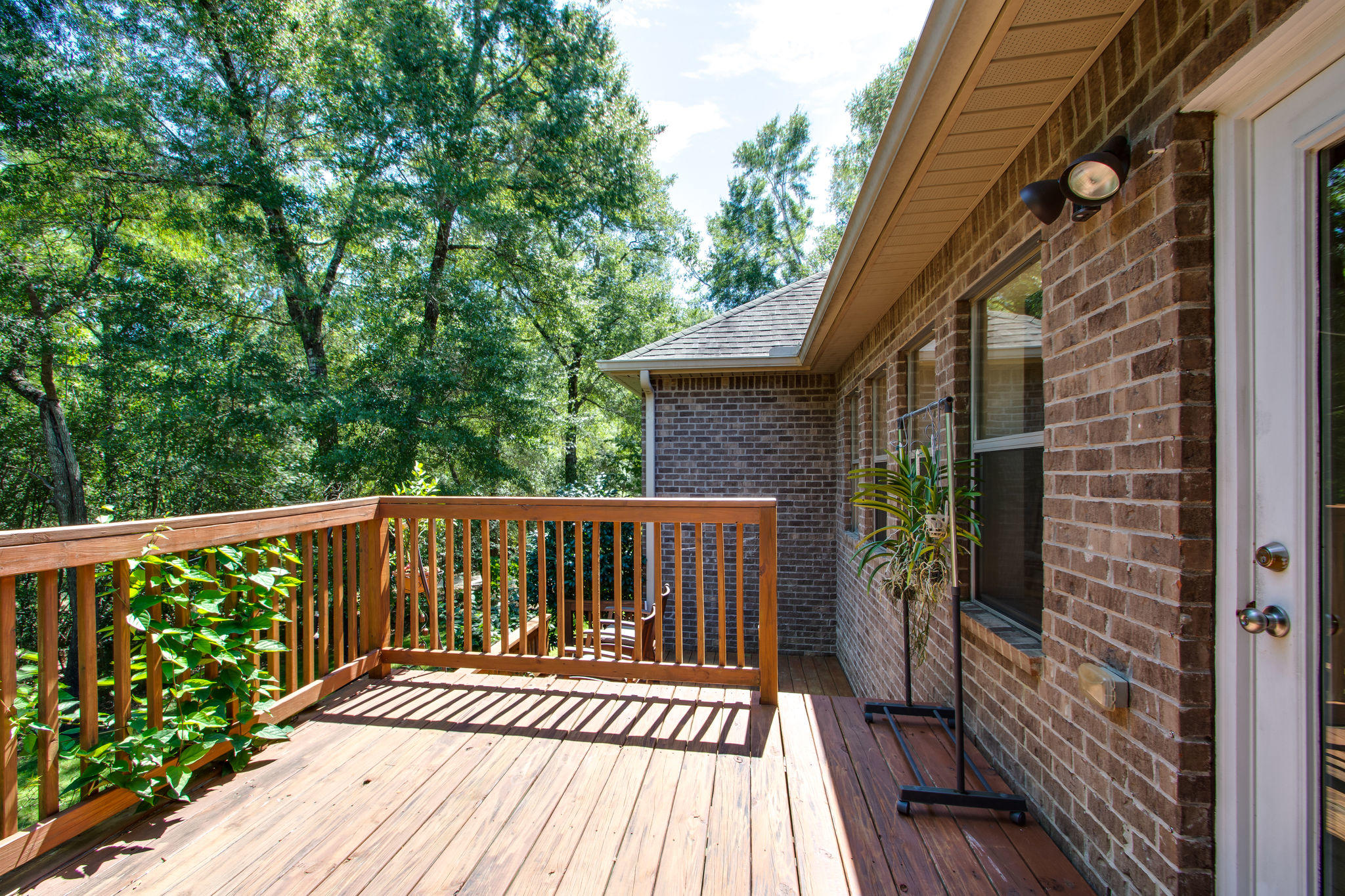 446 Mango Lane Freeport, FL 32439 - Photo 29 of 48 a view of deck with wooden floor and chair