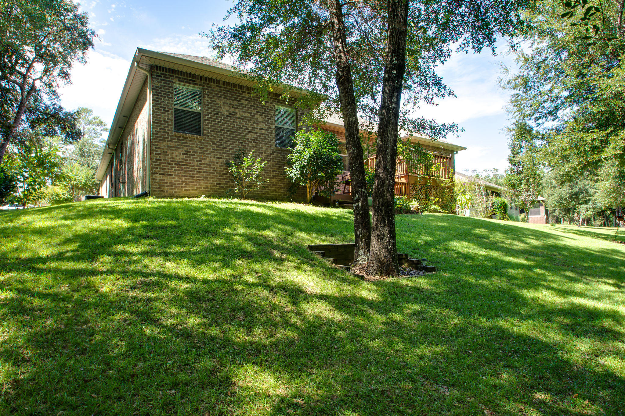 446 Mango Lane Freeport, FL 32439 - Photo 31 of 48 a backyard of a house with lots of green space