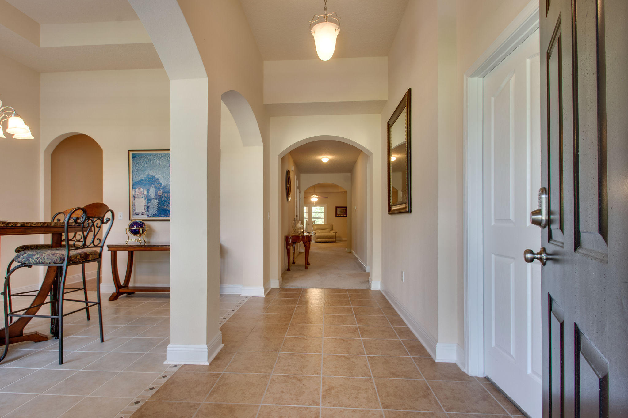 446 Mango Lane Freeport, FL 32439 - Photo 5 of 48 a view of a hallway view with furniture and a fireplace