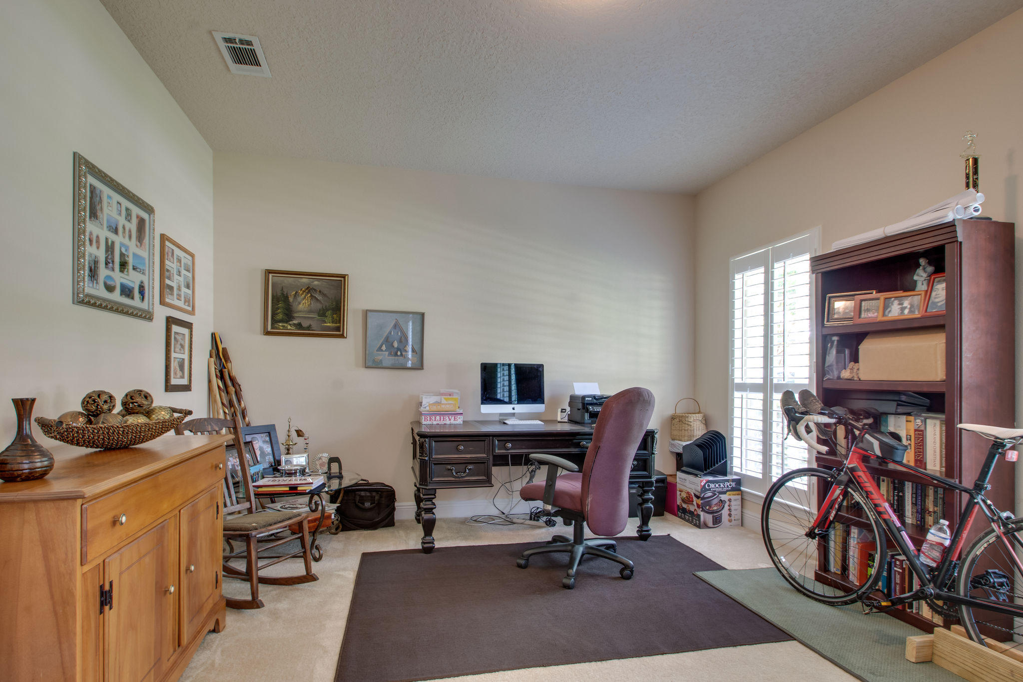 446 Mango Lane Freeport, FL 32439 - Photo 6 of 48 a view of a workspace with furniture and a window