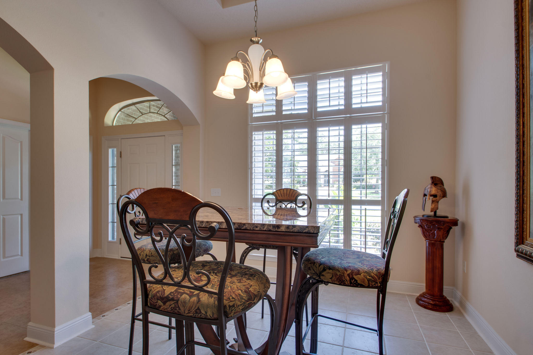 446 Mango Lane Freeport, FL 32439 - Photo 8 of 48 a view of a dining room with furniture window and wooden floor