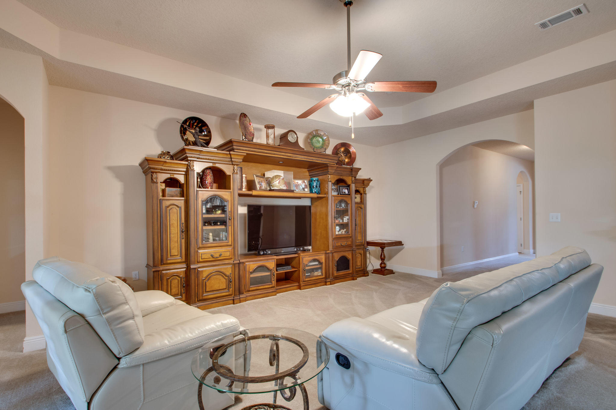 446 Mango Lane Freeport, FL 32439 - Photo 10 of 48 a living room with furniture a chandelier and a flat screen tv