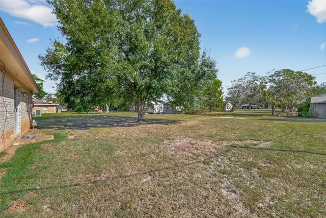 a view of outdoor space with deck and yard