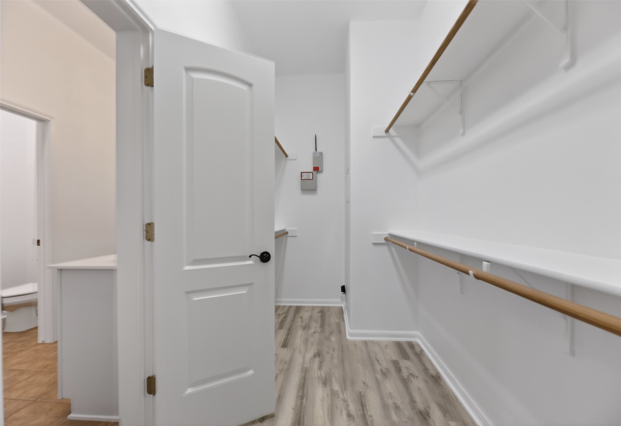 545 Manchester Lane Austin, TX 78737 - Photo 16 of 30 a view of a hallway view with wooden floor and staircase