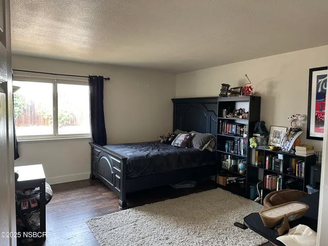 a bedroom with a bed furniture and a window