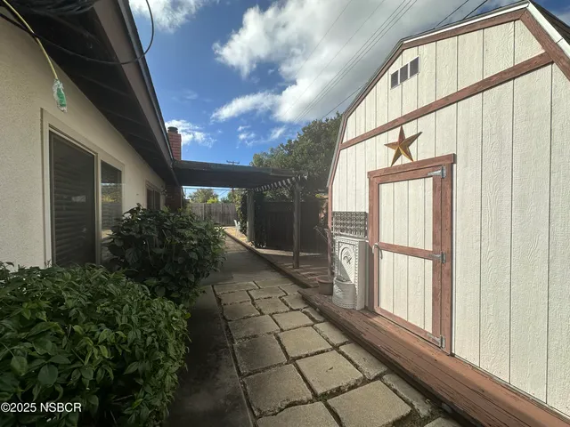 a view of backyard with seating area