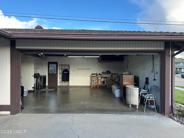 a living room with a table and chairs