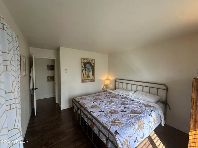 a bedroom with a bed and a table in it