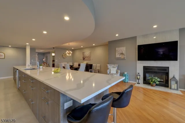 a large kitchen with a table and chairs