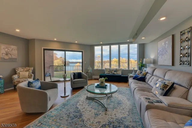 a living room with furniture fireplace and flat screen tv
