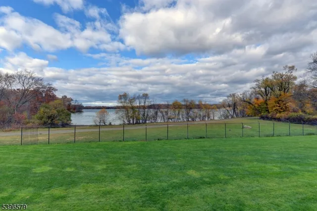 a spacious bedroom with a bed and a large window