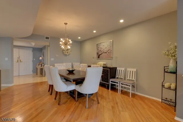 a view of kitchen with stainless steel appliances granite countertop a stove a sink and a refrigerator