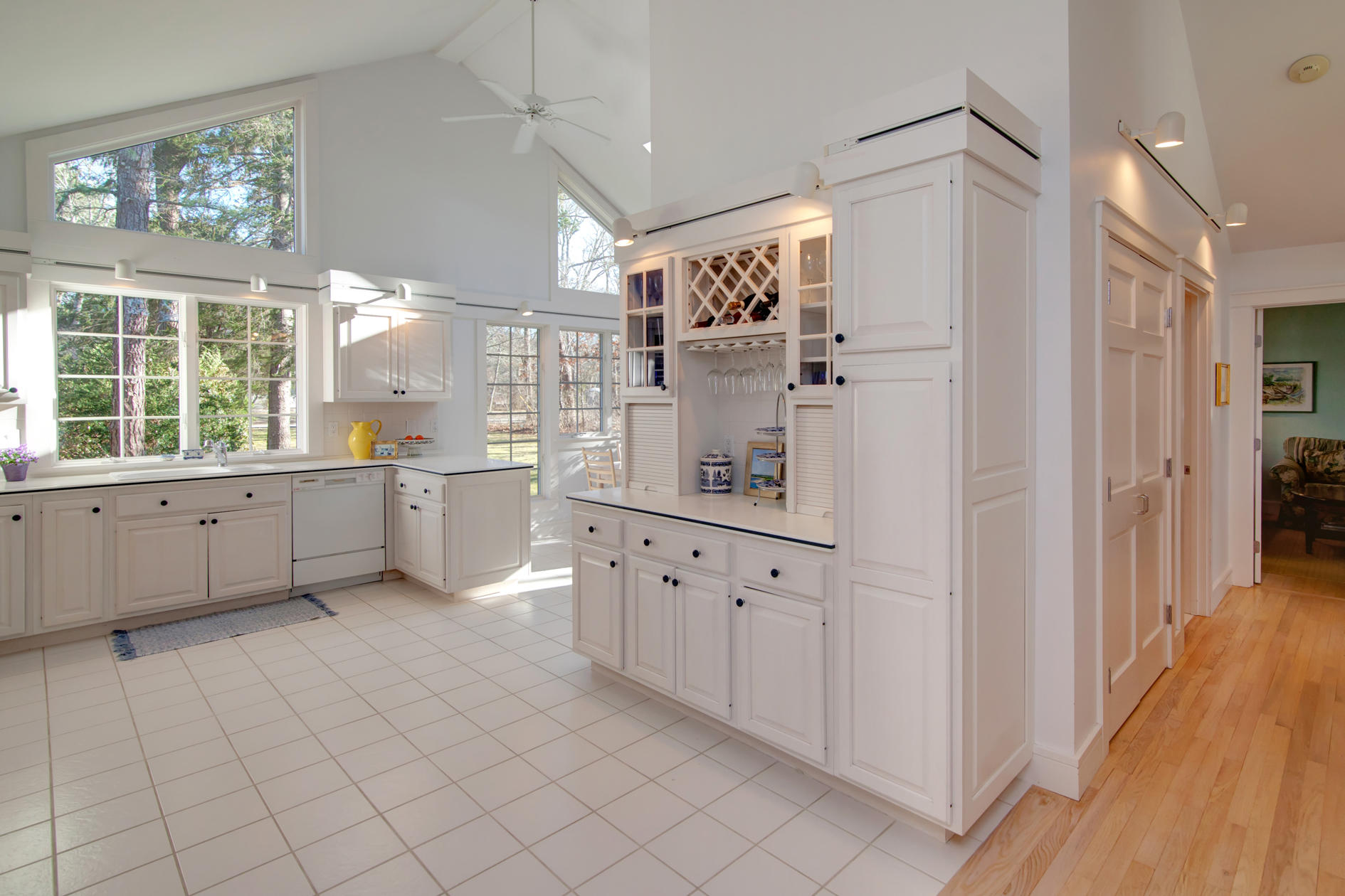 624 Poponessett Road Cotuit, MA 02635 - Photo 12 of 30 a large white kitchen with cabinets