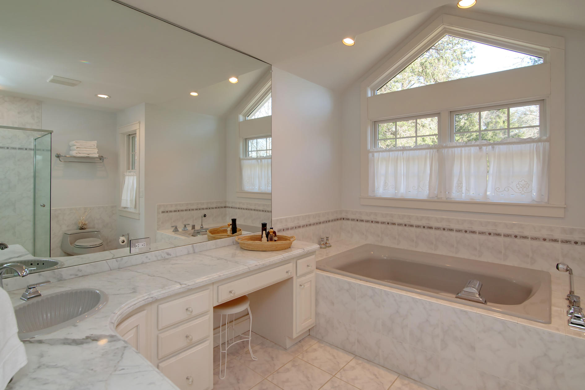 624 Poponessett Road Cotuit, MA 02635 - Photo 18 of 30 a bathroom with a granite countertop sink mirror and bathtub
